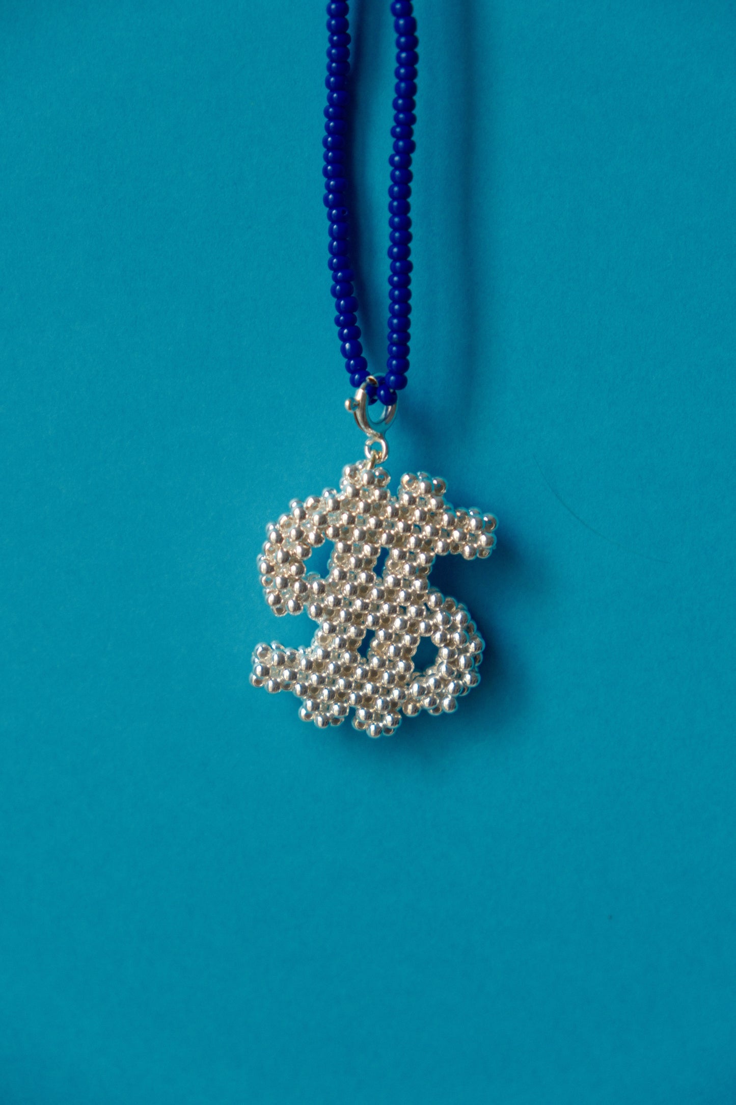 Silver dollar charm