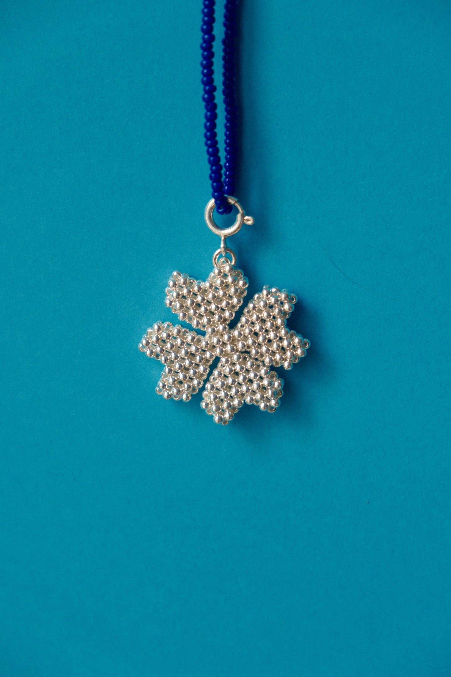 Silver clover charm