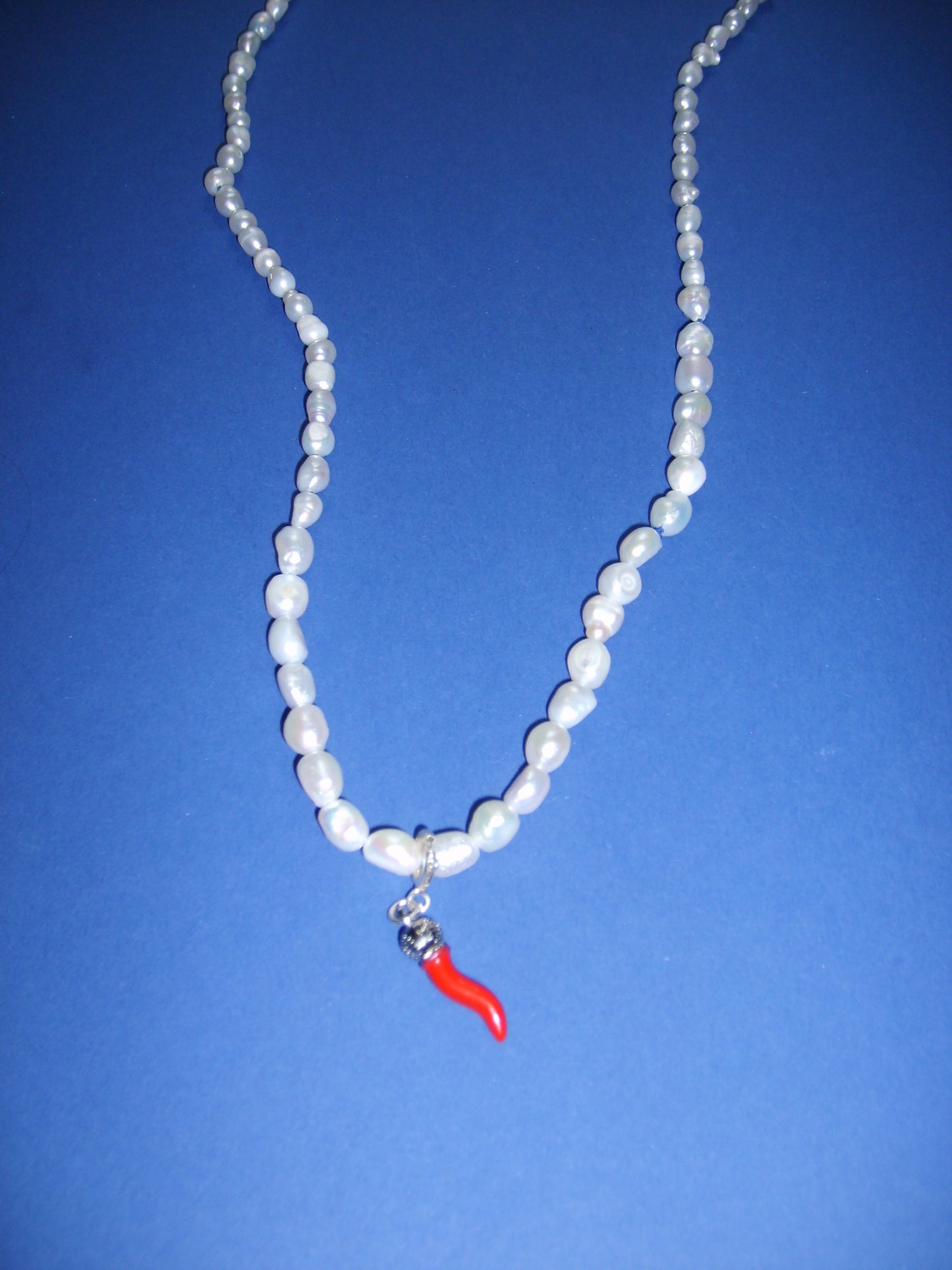 Pearl necklace with pepper charm