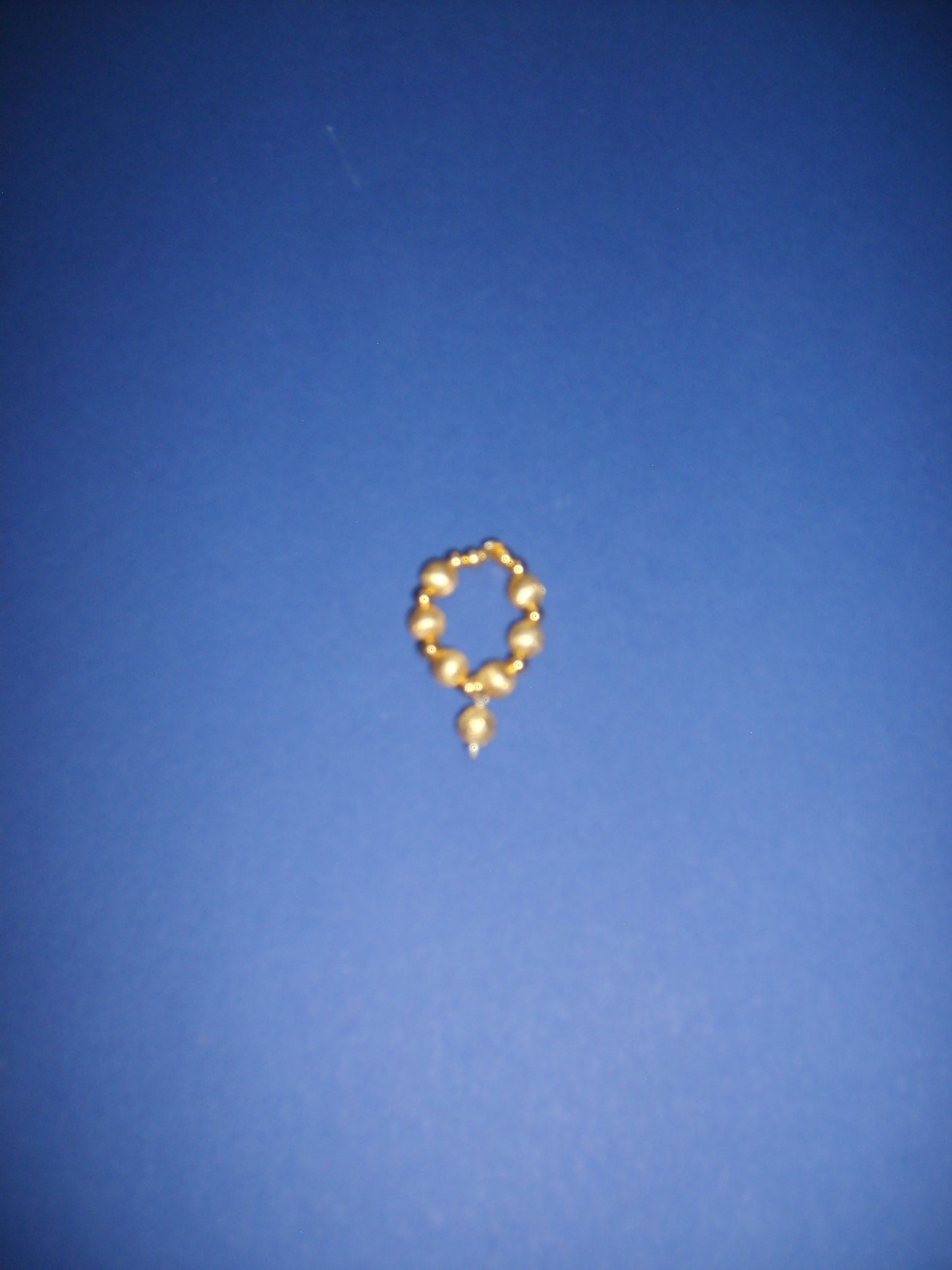 Gold plated ring with small ball