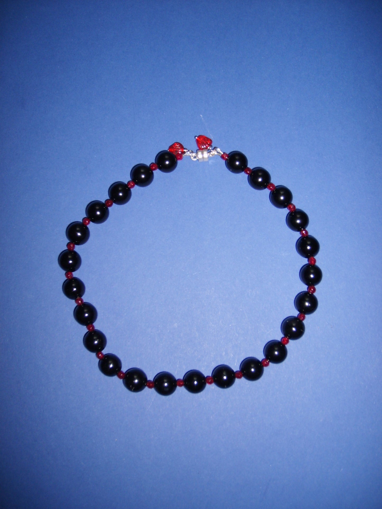 Short black onyx with pomegranate necklace