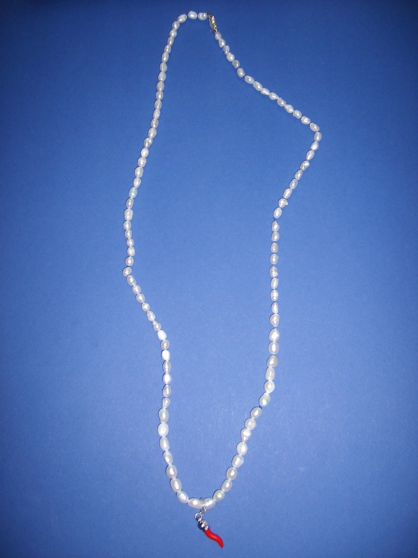 Pearl necklace with pepper charm