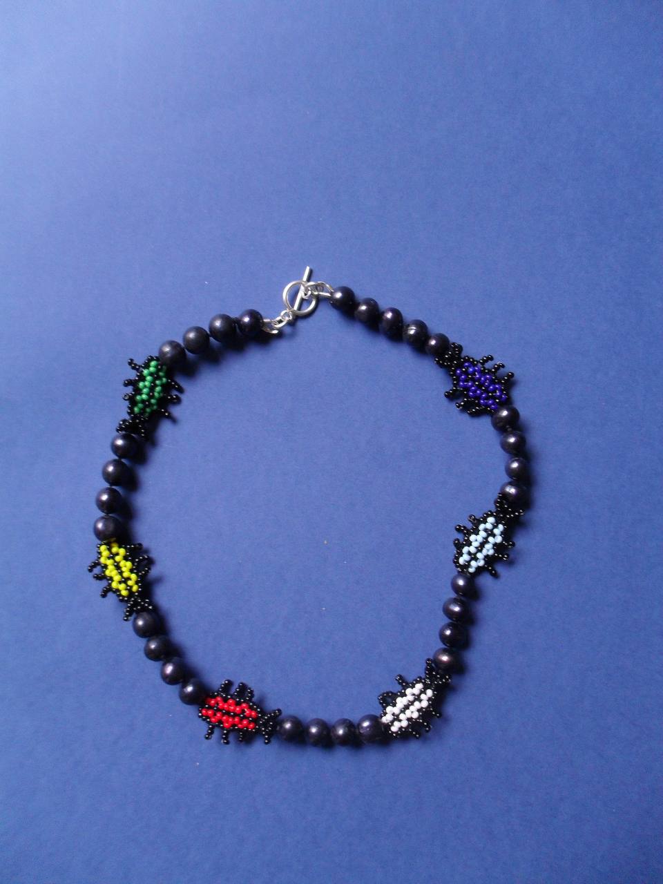 Necklace with beetles made of beads
