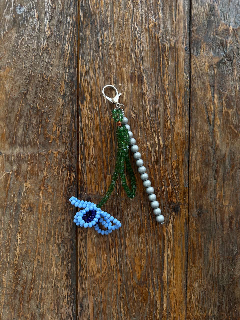 Key-ring with blue flower and beads