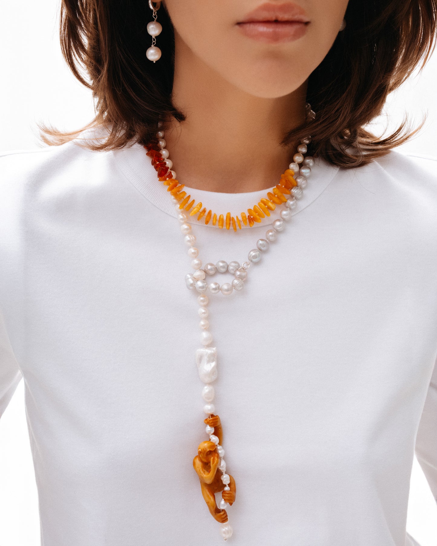 Pearl and amber Necklace with a monkey